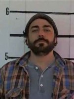 Dalton Kimbrough Man with a dark beard and mustache